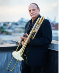 David Taylor standing with his trombone